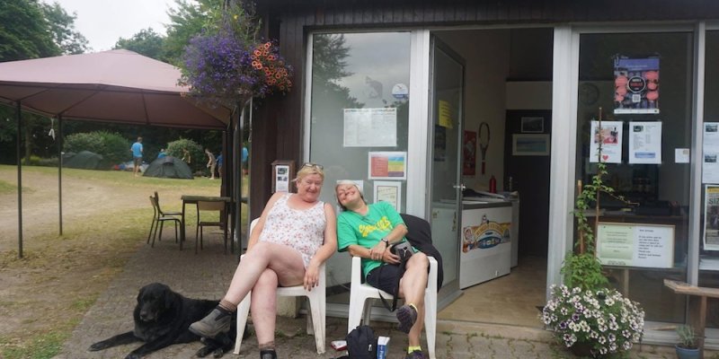 Two women sitting outside and laughing